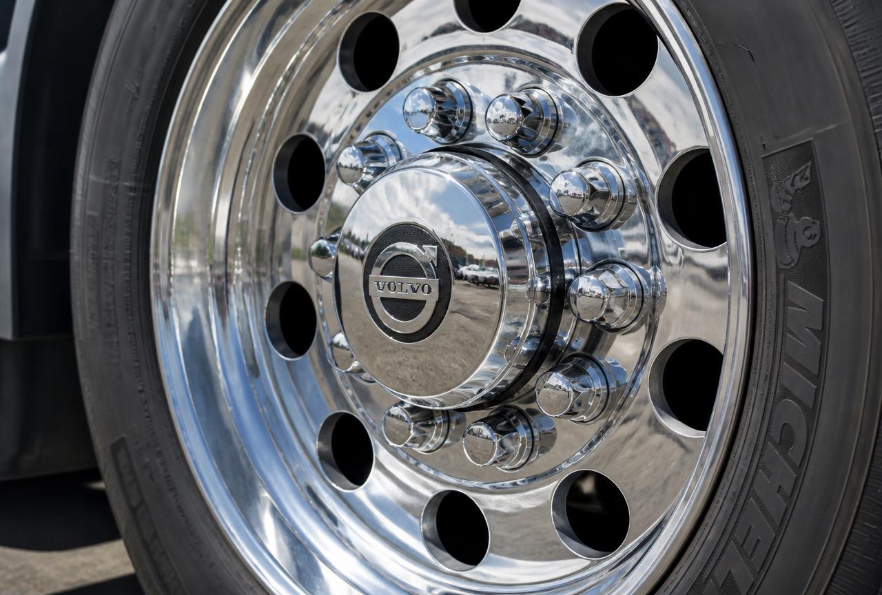 Chrome hub cover and lug nut covers on a Volvo steer axle wheel